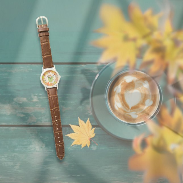 Fall Break Cat Watch (A Fall Break Cat Watch is on the table outside. )