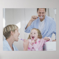 Family brushing teeth together