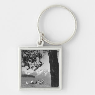 Family having picnic by lake mountains key ring