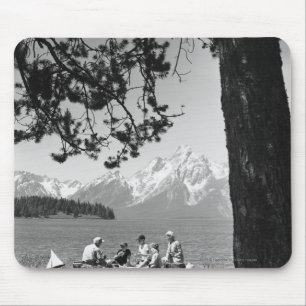 Family having picnic by lake mountains mouse pad