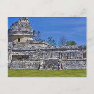 Family of tourists walk past ancient Mayan Postcard