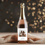 Family Photo & Merry and Bright Minimalistic  Wine Label<br><div class="desc">Make your holiday celebrations extra special with our Family Photo & Merry and Bright Minimalistic Christmas Wine Label. Featuring a clean, modern design with "Merry and Bright" and a space for your favourite family photo, this personalised wine label adds a unique and festive touch to your wine bottles. Perfect for...</div>