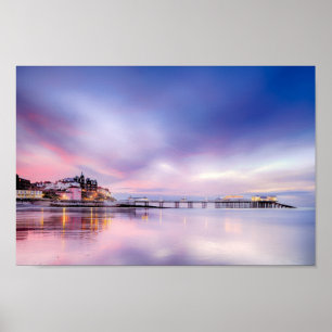 Famous Cromer pier in Norfolk England with pink su Poster