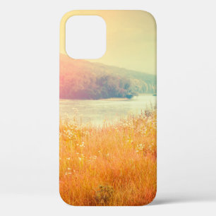 Fantastic foggy river with fresh grass in the sunl iPhone 12 case