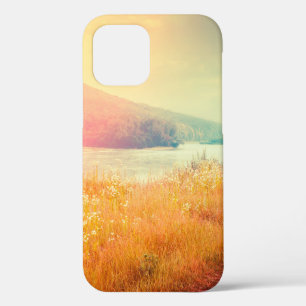 Fantastic foggy river with fresh grass in the sunl iPhone 12 case
