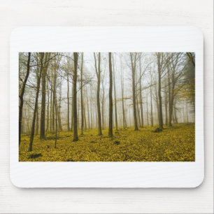 Fantasy forest with fog and yellow leaves mouse pad