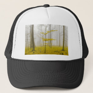 Fantasy forest with fog and yellow leaves trucker hat