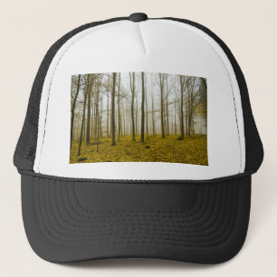 Fantasy forest with fog and yellow leaves trucker hat