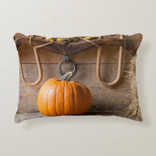 Farmers Museum. Pumpkin in barn with bale of hay Decorative Cushion