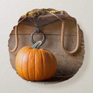 Farmers Museum. Pumpkin in barn with bale of hay Round Cushion