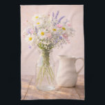 Farmhouse Wildflower Jar and Ceramic Pitcher  Tea Towel<br><div class="desc">This farmhouse wildflower kitchen towel features a soft bouquet of daisies, lavender, and delicate pink flowers arranged in a clear glass jar beside a classic white ceramic pitcher. The warm rustic wooden table and gentle natural lighting create a peaceful cottage inspired scene. Perfect for farmhouse kitchens, dining rooms, bedrooms, or...</div>