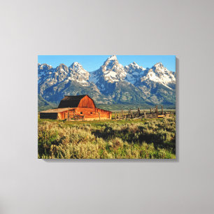 Farms Barn Shadowed by Snow Capped Mountains Canvas Print