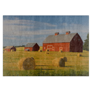 Farms   Red Barns Near Hay Bales Cutting Board