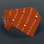 Father of the Groom Repeating Text Rust Orange Tie<br><div class="desc">This fun rust orange or burnt umber coloured neck tie is the perfect accessory for the father of the groom at your wedding. It features a simple yet elegant design with the word "Father of the Groom" written in a sophisticated all capital white font, and repeating in a diagonal pattern...</div>