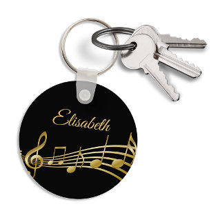 Faux gold music notes on an elegant black backdrop key ring