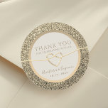 Faux Gold Wedding Thank You Classic Round Sticker<br><div class="desc">Add a touch of elegance to your wedding favours with our Simple, Elegant, Luxury Cream Ivory and Glitter Faux Gold Thank You Sticker. Featuring a romantic rope heart, these stickers exude sophistication and charm. Perfect for expressing gratitude with style, they're the ideal finishing touch to your celebration, leaving a lasting...</div>