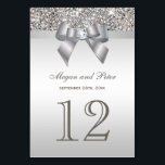 Faux Silver Sequins Bow Wedding Table Number Cards<br><div class="desc">Elegant custom silver wedding table number cards with a beautiful printed silver sequins pattern, a cute shiny silver printed bow and ribbon and pretty printed diamond bling jewel. These classy, glamourous, fashionable cards are decorated both sides. PLEASE NOTE: These are flat printed graphics - no real bows, sequins or raised...</div>