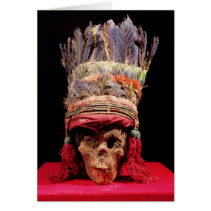 Feathered headdress on a skull, from Peru