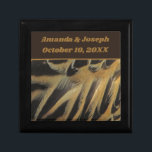 Feathers Layered Brown Gold Wedding Keepsake Gift Box<br><div class="desc">This beautiful wedding keepsake gift box features a photo of elegant duck feathers.  The beautiful brown and gold feathers form long ovals that overlap revealing wispy feathering.  Quickly and easily personalise the bride and groom's names and wedding date which appears against a solid dark brown banner.</div>