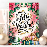 Feliz Navidad Poinsettia Christmas Holiday Card<br><div class="desc">Celebrate Christmas with a beautiful "Feliz Navidad" card, featuring vibrant poinsettias, lush greenery, and festive gifts. This card captures the warmth and joy of the holiday season, making it perfect for sending Christmas wishes to friends and family who celebrate in Spanish. With its traditional holiday elements, this card spreads cheer...</div>