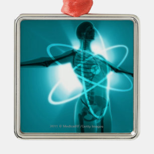Female figure with an overlay of an atomic symbol metal tree decoration