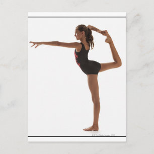 Female gymnast (12-13) balancing on one leg postcard