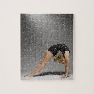 Female gymnast stretching, studio shot 2 jigsaw puzzle