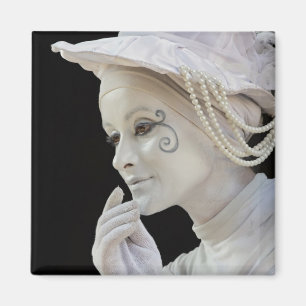 Female mime performing on street corner magnet