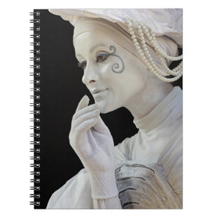 Female mime performing on street corner notebook