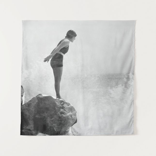 Female swimmer on rock above crashing surfvintage, tapestry (Front)