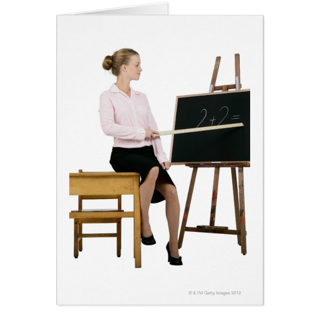 Female Teacher Pointing Ruler at Chalkboard (Front)