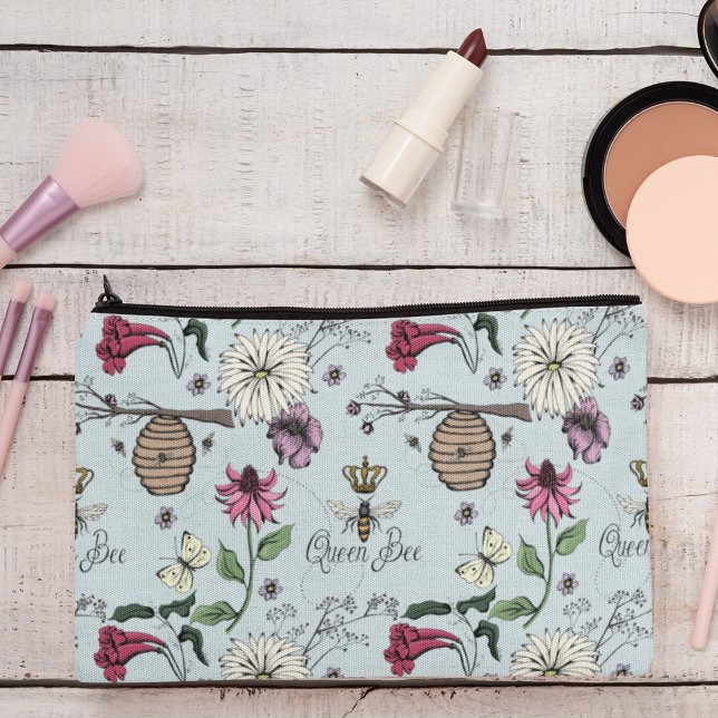 Feminine Blue Queen Bee & Gold Crown Accessory Pouch (Chic and Trendy Queen Bee & Exotic Flowers Makeup or Accessory Pouch on an Elegant Blue Background.)