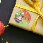 Festive Christmas Ornaments Twinkling Gold Lights Classic Round Sticker<br><div class="desc">This customisable Christmas sticker, set against a vibrant green backdrop, captures the essence of the festive season with its trio of beautifully designed Christmas ornaments in radiant hues of red, green, and gold, suspended from delicate golden strings. The sticker is further embellished with a heartwarming "Merry Christmas" message, penned in...</div>