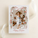 Festive Christmas Ribbon with Poinsettias Foil Holiday Card<br><div class="desc">Send you family and friends a family update and message of holiday cheer with this one-photo Christmas card featuring a trendy, hand-drawn illustration of a rust red ribbon accented with festive sprigs of red poinsettia flowers, greenery and real gold foil metallic berry dots. Traditional fonts keep the design feeling high...</div>