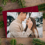Festive Elegance Merry Christmas Burgundy Photo Holiday Card<br><div class="desc">Simple holiday card featuring your full-bleed horizontal photo with "Merry Christmas" displayed in elegant white lettering. Personalise the elegant photo Christmas card with your family name and the year. The card reverses to display a burgundy background with subtle white dots.</div>