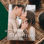 Festive Elegance Merry Christmas Green Photo Holiday Card<br><div class="desc">Simple holiday card featuring your full-bleed vertical photo with "Merry Christmas" displayed in elegant white lettering. Personalise the elegant photo Christmas card with your family name and the year. The card reverses to display a green background with subtle white dots.</div>
