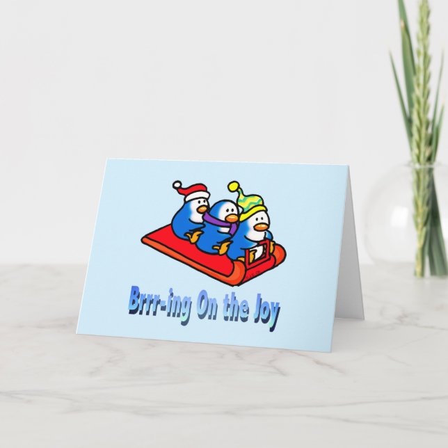 Festive Sledding Penguins in Winter Scene Holiday Card (Front)