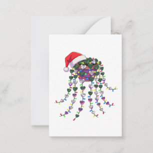 Festive Tropical Houseplant Wearing a Santa Hat Card