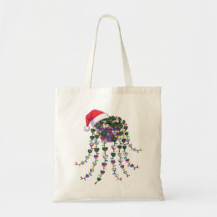 Festive Tropical Houseplant Wearing a Santa Hat Tote Bag