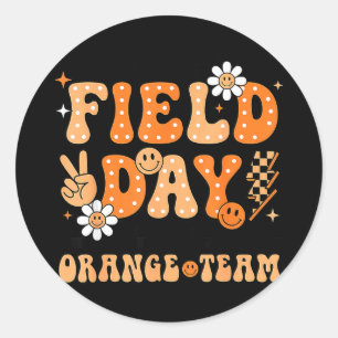 Field day orange team groovy smile face chequered classic round sticker