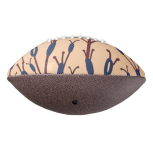 Field of Cat Tails against a Peach Background Football