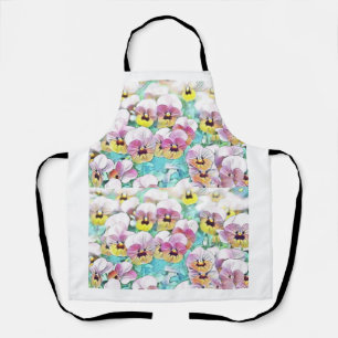 Field of pink yellow and white pansies apron
