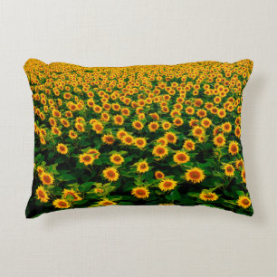 Field with bright yellow sunflowers in sunny day. decorative cushion