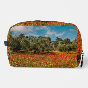 field with flowers and trees dopp kit