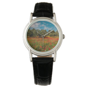 field with flowers and trees watch