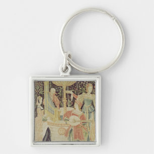 Figures around a fountain key ring