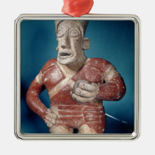 Figurine of a tlachtli player wearing a helmet metal tree decoration