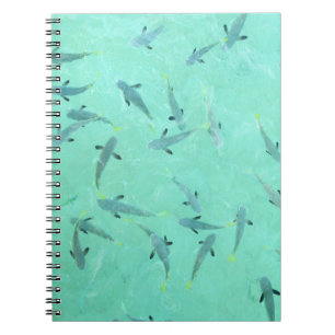 Fiji fish swimming in clear blue water notebook