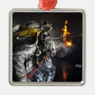 Firefighters extinguish a fire in a training ro metal tree decoration