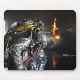 Firefighters extinguish a fire in a training ro mouse pad